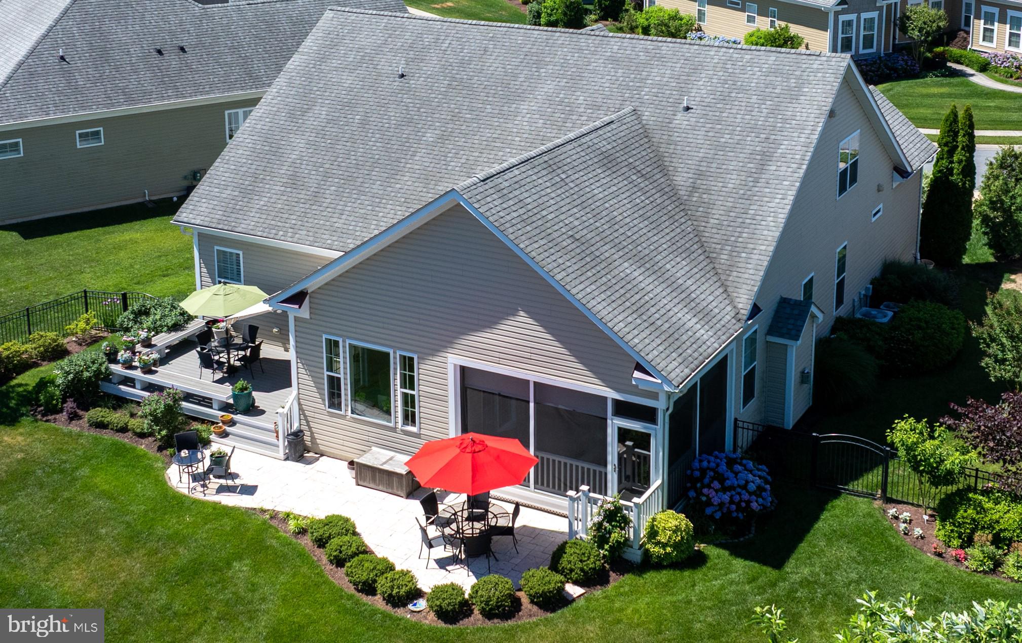 21196 Riviera Way Rehoboth Beach, DE 19971 - Photo 27 of 45 Stone Patio spans from Screened Porch to Trek Deck