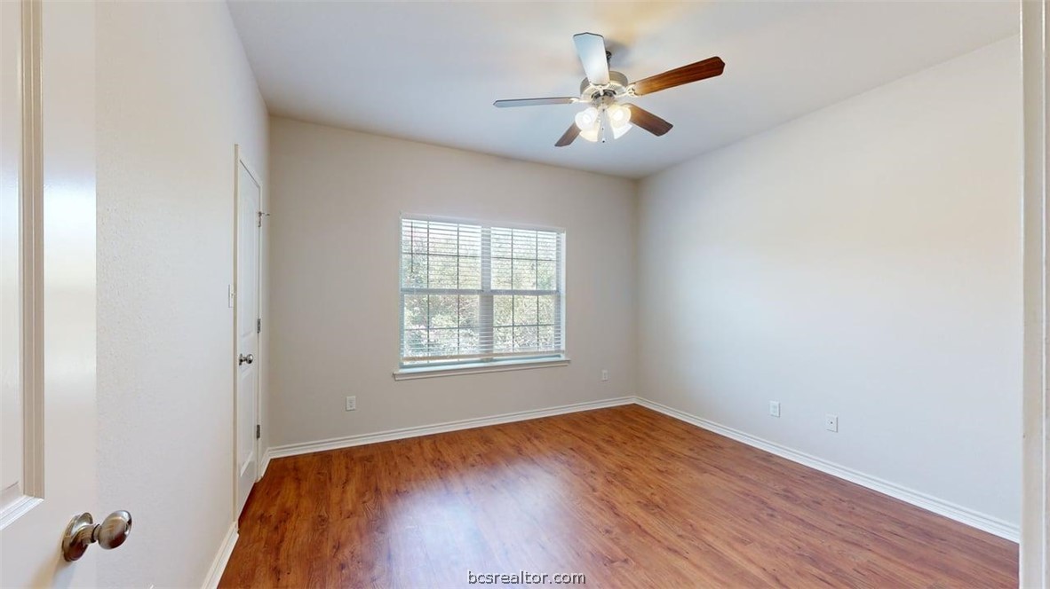 4453-4455 Reveille Road College Station, TX 77845 - Photo 12 of 37 wooden floor in an empty room with a window