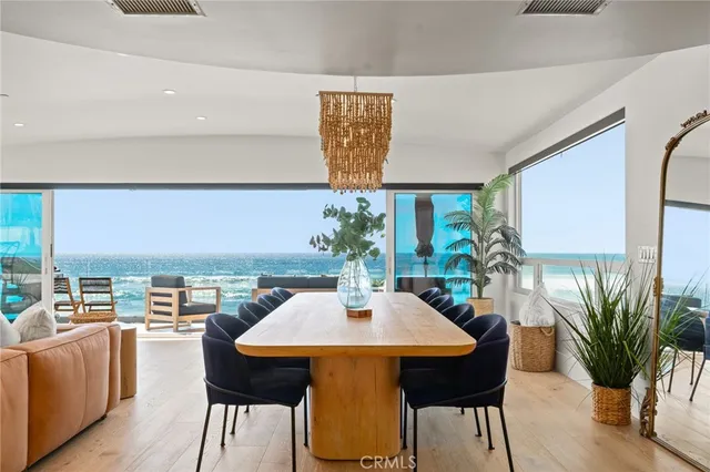 a view of a roof deck with a table and chairs