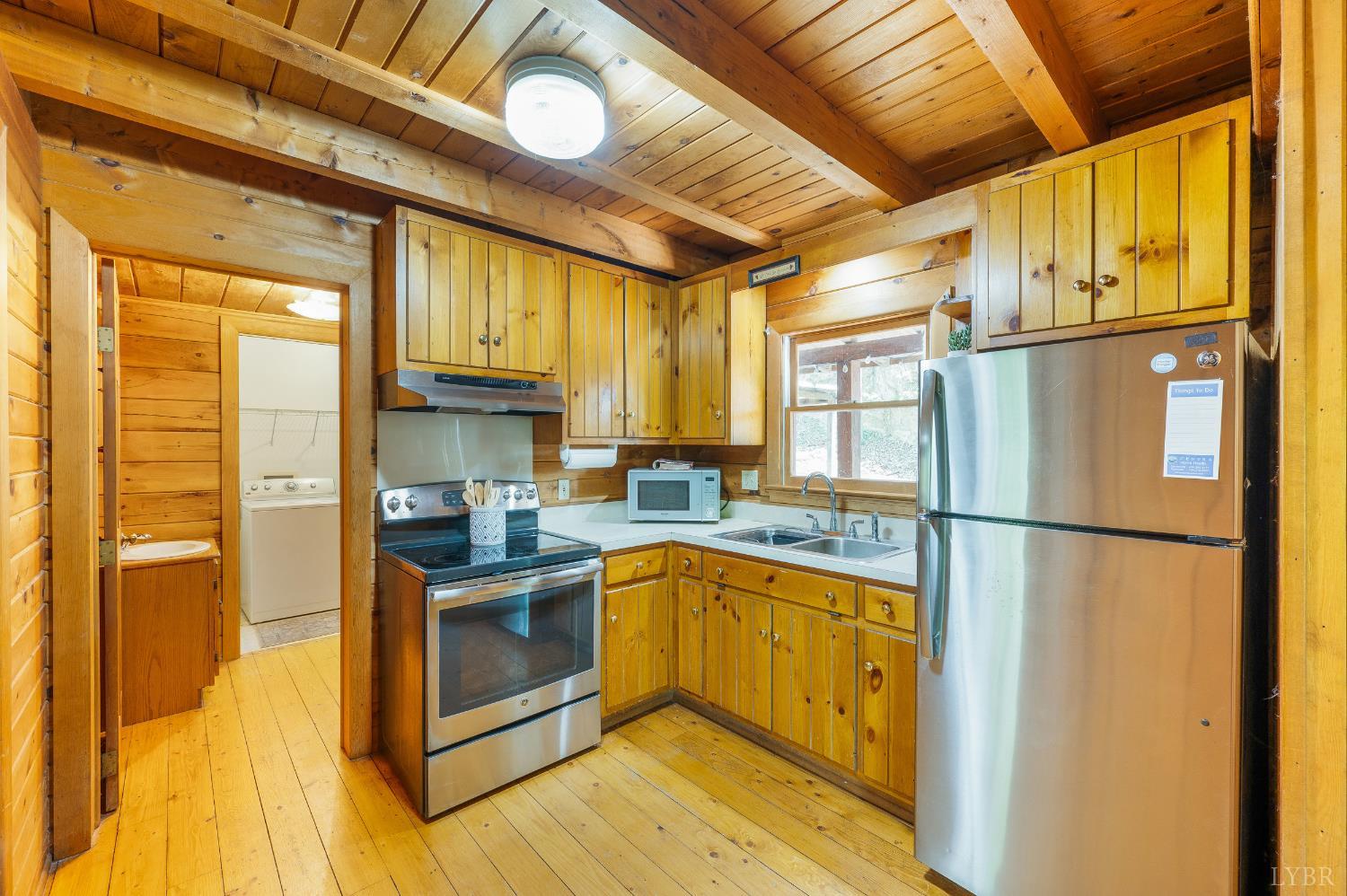 3882 Rocky Mountain Road Forest, VA 24551 - Photo 12 of 69 a kitchen with stainless steel appliances granite countertop a refrigerator a oven and white cabinets with wooden floors