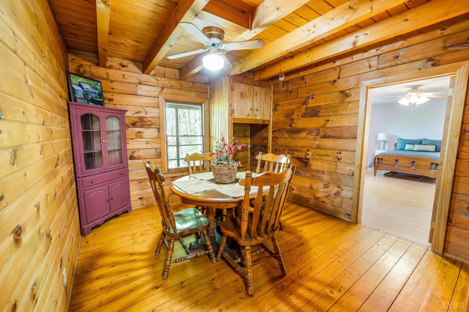 3882 Rocky Mountain Road Forest, VA 24551 - Photo 17 of 69 a view of a dining room with furniture and wooden floor