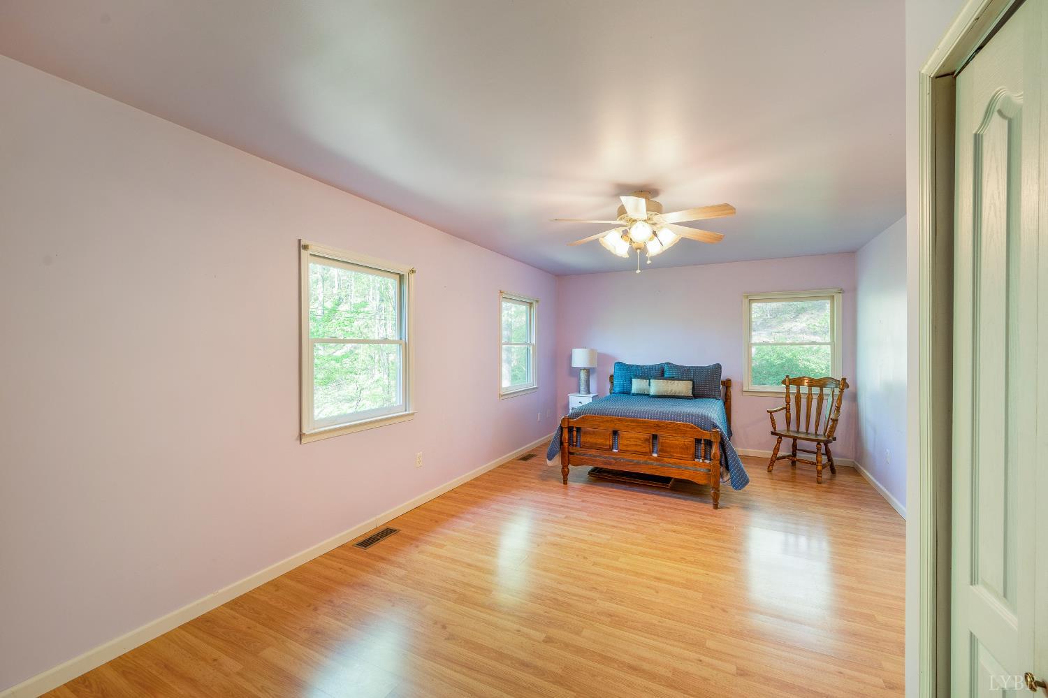 3882 Rocky Mountain Road Forest, VA 24551 - Photo 19 of 69 a bedroom with a bed and a chandelier