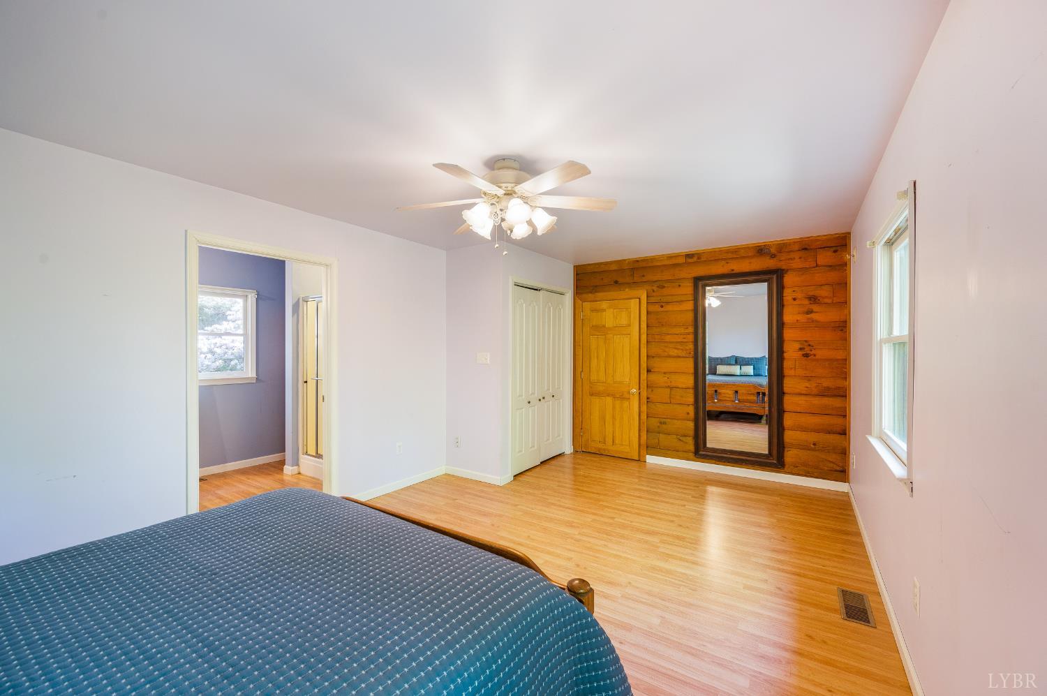 3882 Rocky Mountain Road Forest, VA 24551 - Photo 20 of 69 a bedroom with a bed and a chandelier