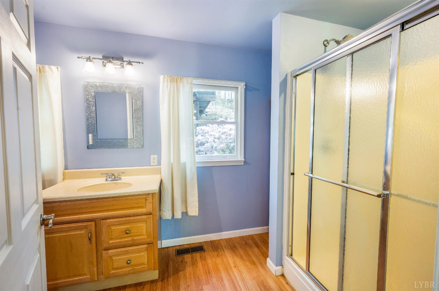3882 Rocky Mountain Road Forest, VA 24551 - Photo 21 of 69 a bathroom with a sink and a mirror