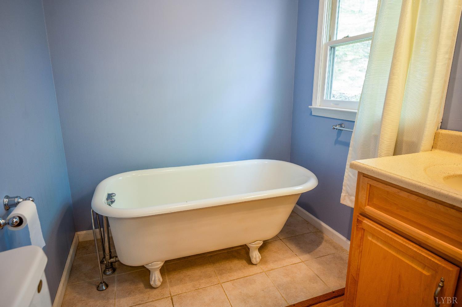 3882 Rocky Mountain Road Forest, VA 24551 - Photo 23 of 69 a white bath tub sitting in a bathroom next to a window
