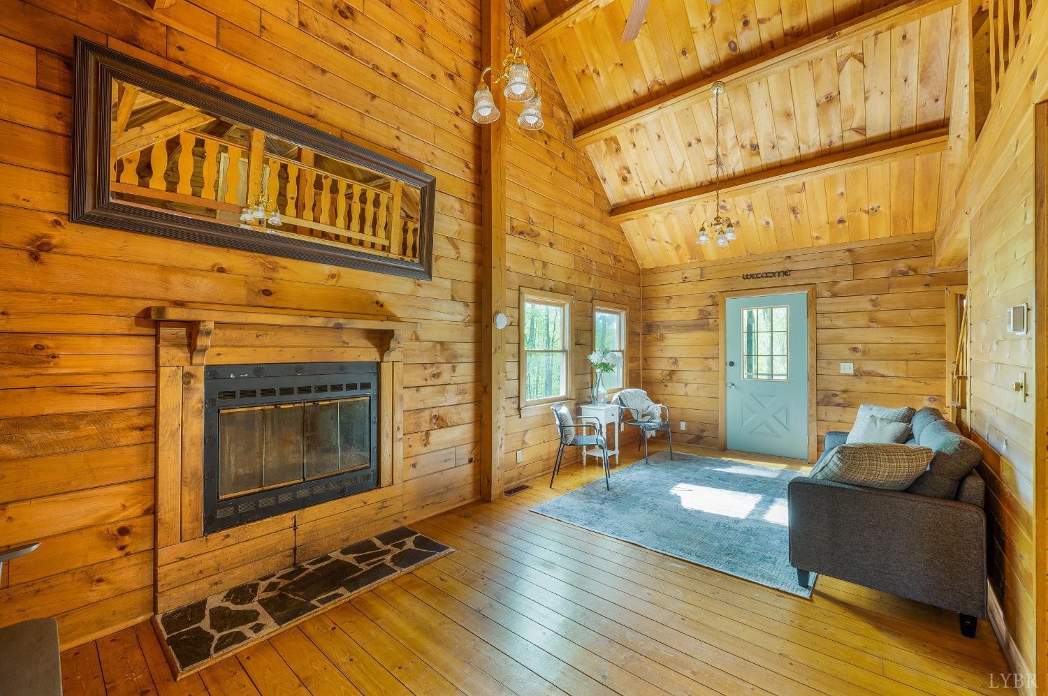 3882 Rocky Mountain Road Forest, VA 24551 - Photo 5 of 69 a living room with furniture windows and a fireplace