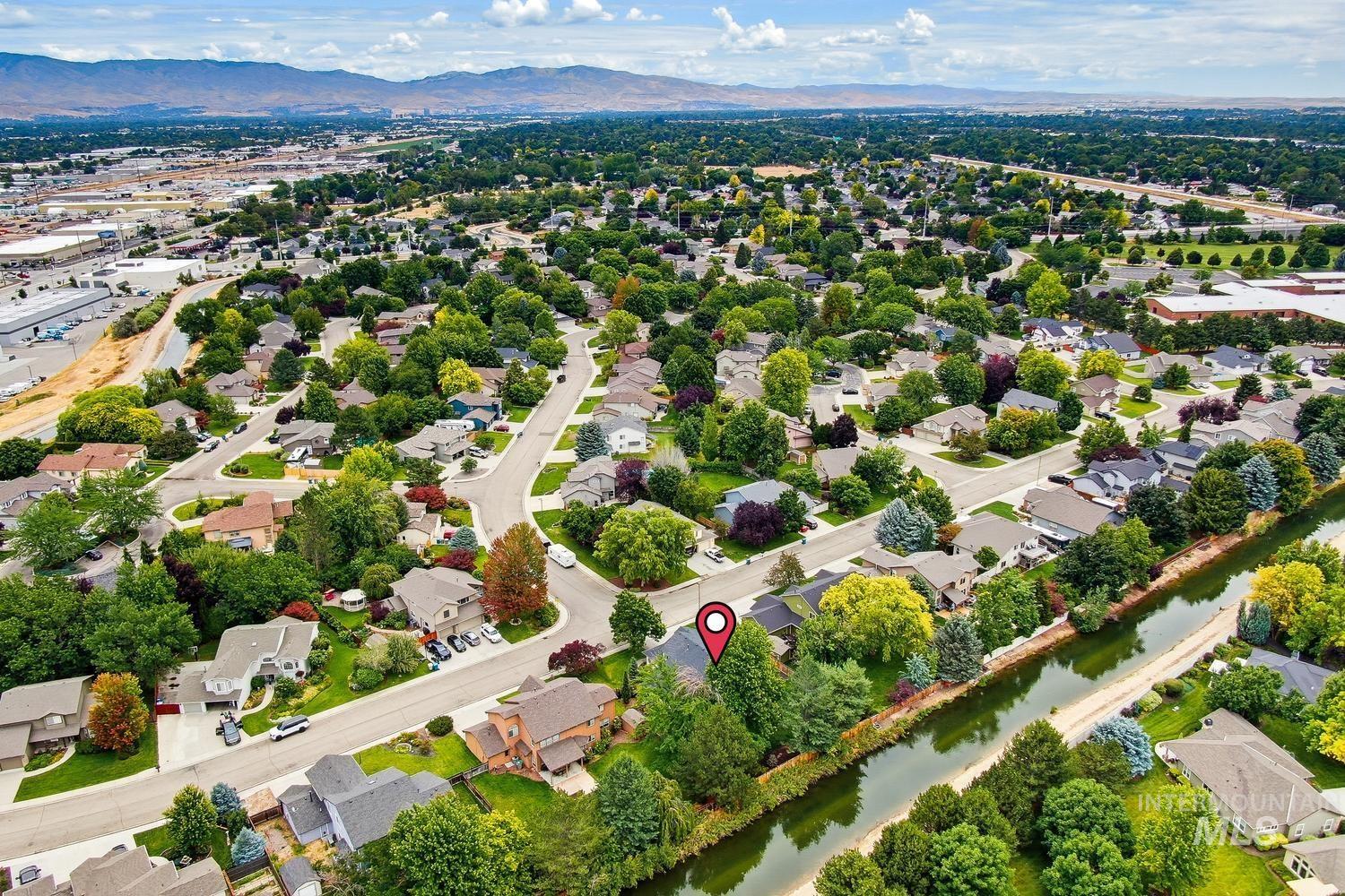369 South Winthrop Way Boise, ID 83709 - Photo 45 of 50 Aerial perspective of a residential neighborhood with established homes, mature trees, and winding streets