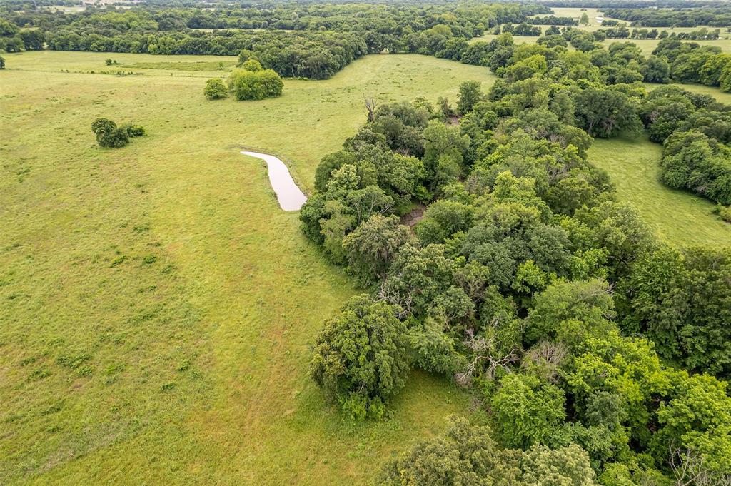 5286 County Road 4502 Commerce, TX 75428 - Photo 14 of 21 a view of a lake with a houses