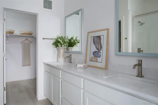 a bathroom with a sink a vanity and a mirror