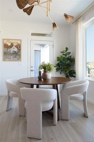 a dining room with furniture and window