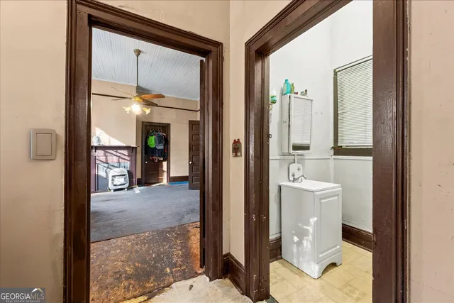 a view of a walk in closet and bathroom