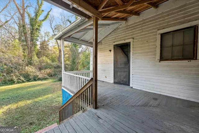 a view of porch with wooden floor and roof