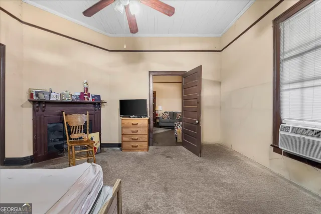 a view of a livingroom with furniture and a flat screen tv