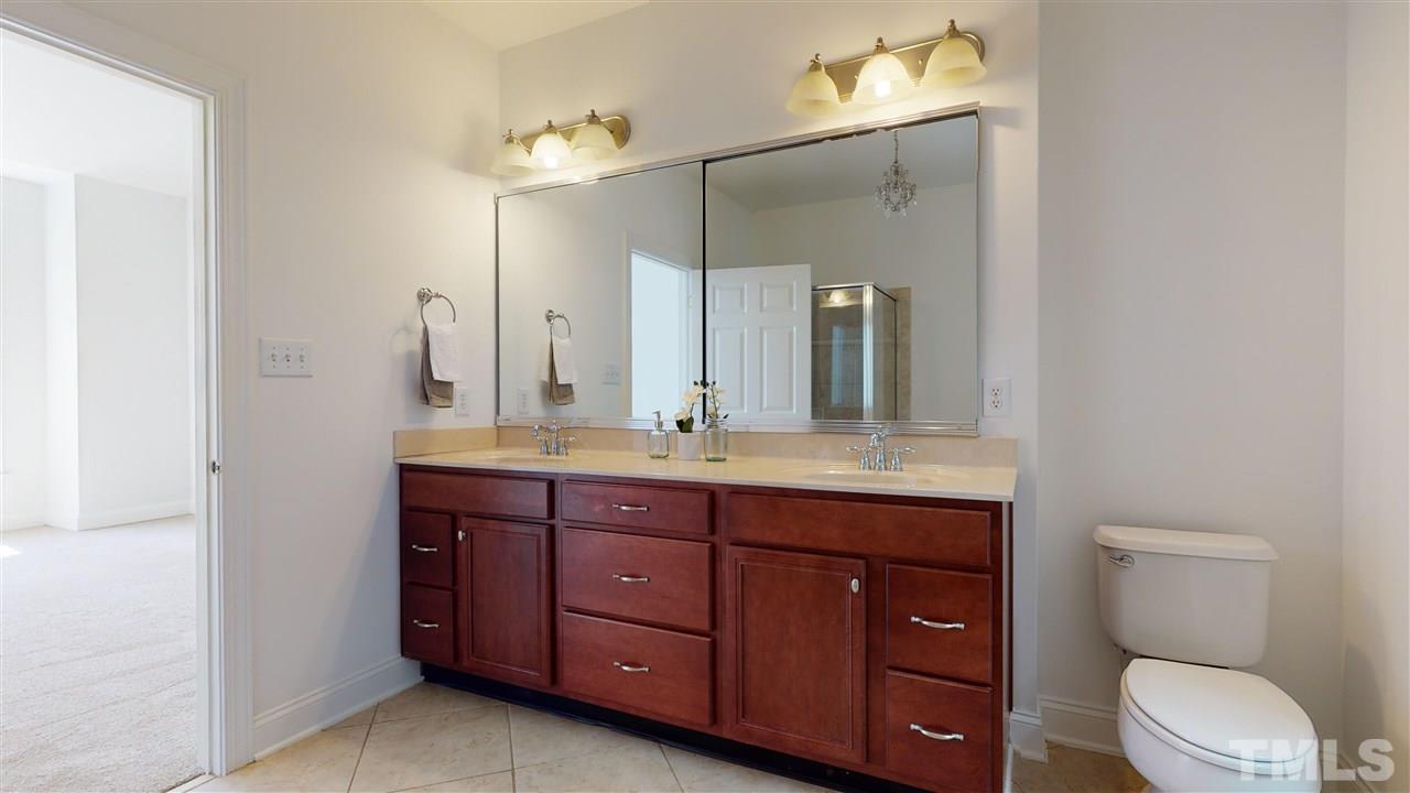 11245 Maplecroft Court Raleigh, NC 27617 - Photo 11 of 30 Generous 1st Floor Master Suite w/ luxurious garden tub, dual vanity, glass/tile shower, & oversized WIC.