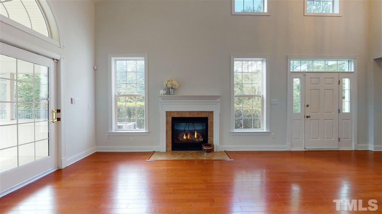 11245 Maplecroft Court Raleigh, NC 27617 - Photo 29 of 30 Open floorplan great for entertaining w/ spacious family room feat. vaulted ceiling & gas log fireplace.