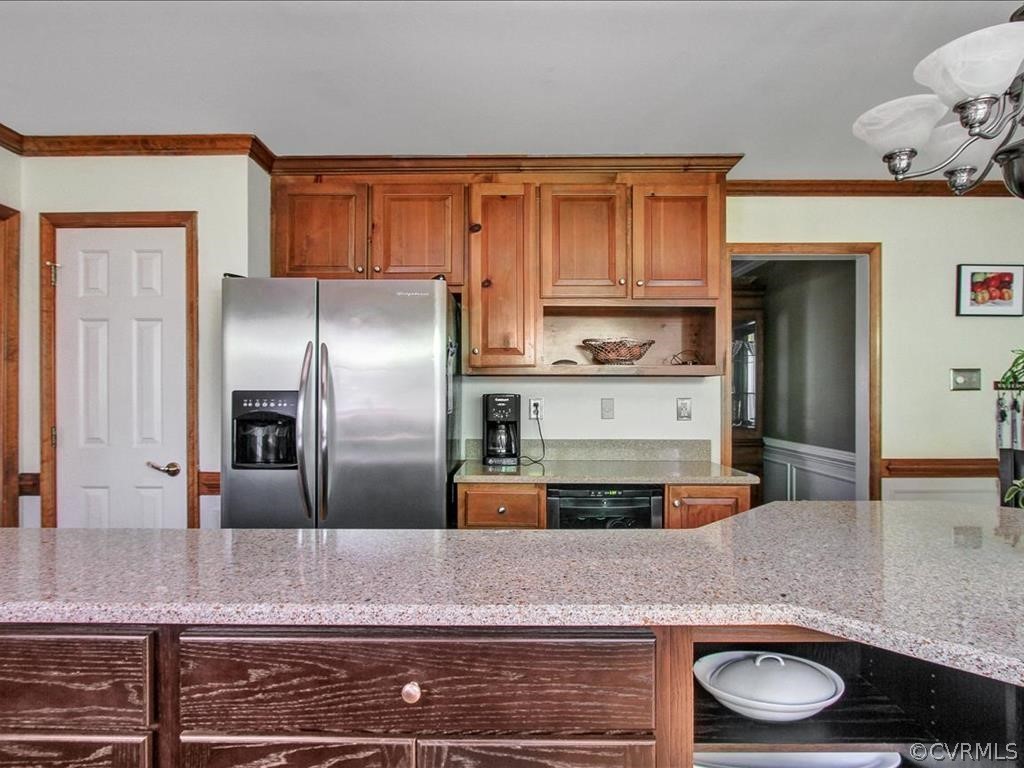 5603 Sandstone Ridge Road Midlothian, VA 23112 - Photo 11 of 39 a kitchen with stainless steel appliances granite countertop a refrigerator and a counter space