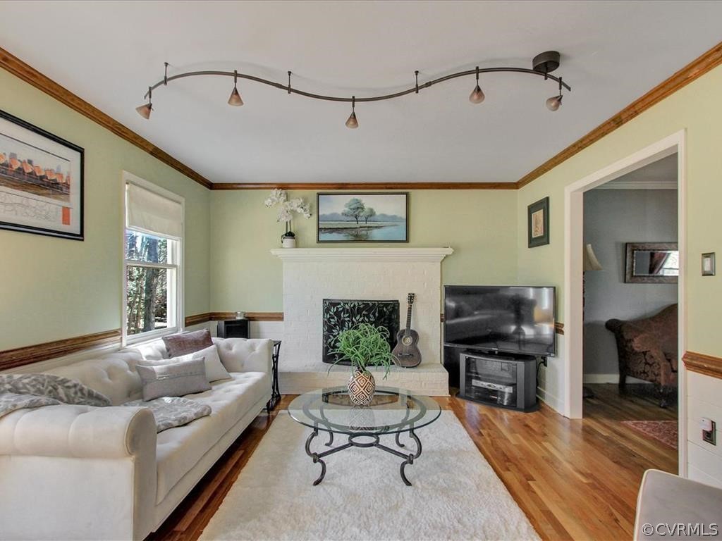 5603 Sandstone Ridge Road Midlothian, VA 23112 - Photo 15 of 39 a living room with furniture and a fireplace