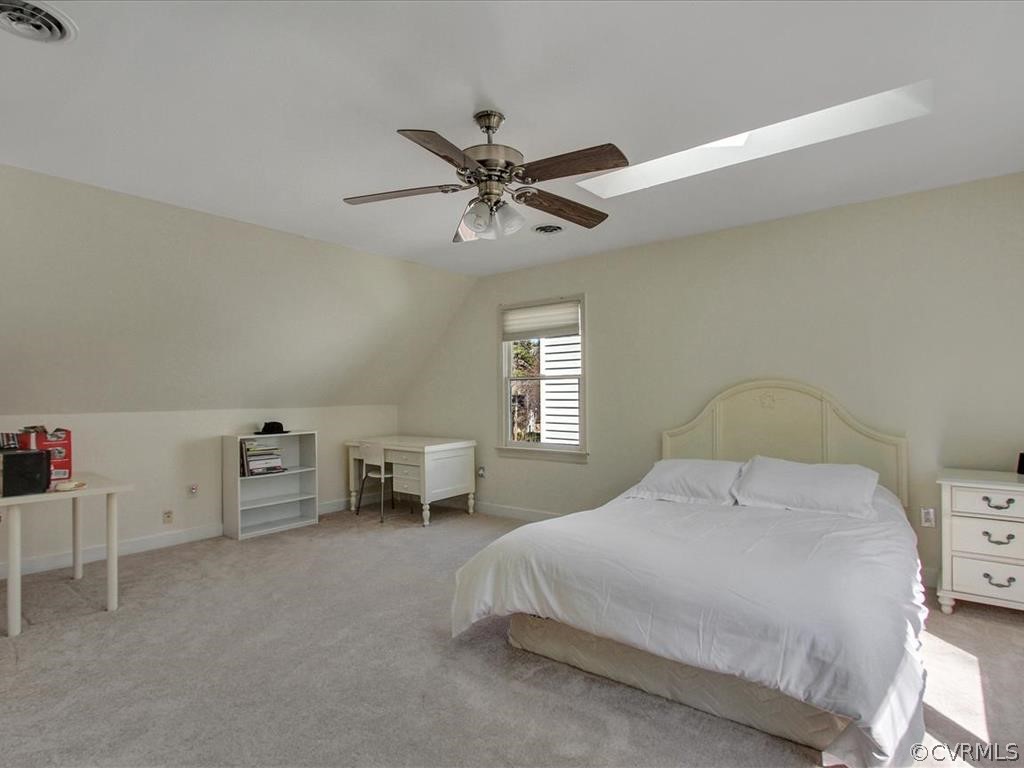 5603 Sandstone Ridge Road Midlothian, VA 23112 - Photo 19 of 39 a bedroom with a bed and a chandelier