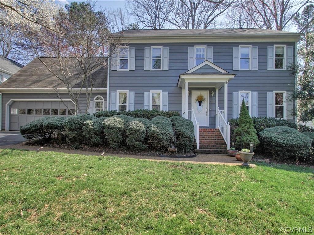 5603 Sandstone Ridge Road Midlothian, VA 23112 - Photo 2 of 39 a front view of a house with a yard and plants