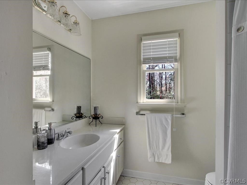 5603 Sandstone Ridge Road Midlothian, VA 23112 - Photo 22 of 39 a bathroom with a sink and a window