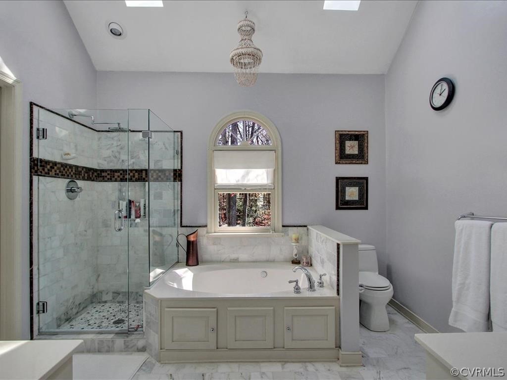 5603 Sandstone Ridge Road Midlothian, VA 23112 - Photo 25 of 39 a spacious bathroom with a bathtub shower sink mirror and toilet