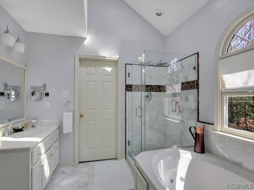 5603 Sandstone Ridge Road Midlothian, VA 23112 - Photo 27 of 39 a bathroom with a tub sink mirror and shower