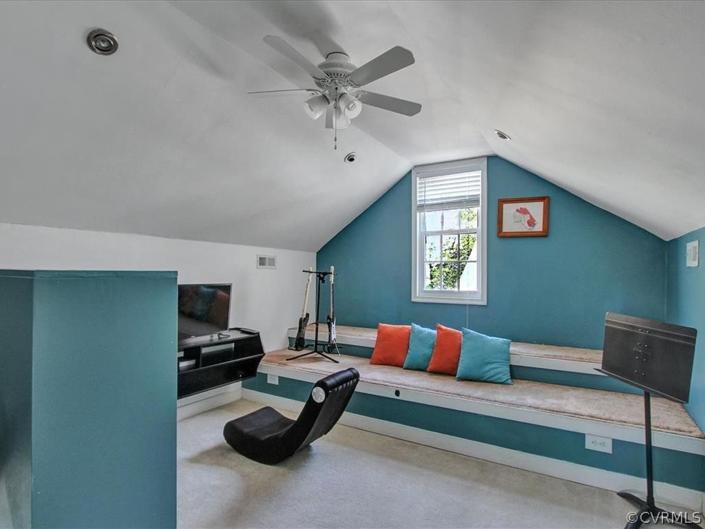 5603 Sandstone Ridge Road Midlothian, VA 23112 - Photo 29 of 39 a living room with furniture a ceiling fan and a rug