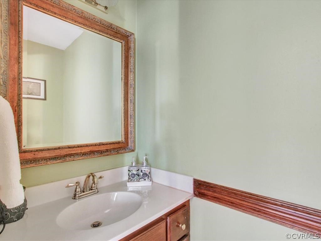5603 Sandstone Ridge Road Midlothian, VA 23112 - Photo 7 of 39 a bathroom with a sink and a mirror