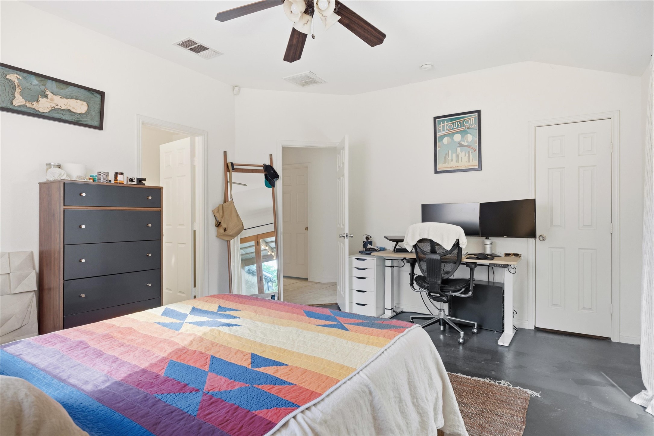 3015 Castro Street Austin, TX 78702 - Photo 24 of 40 Clean lines and a spacious layout define this comfortable bedroom, featuring a workstation ideal for remote work.