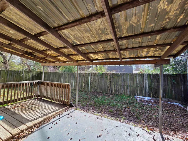 a view of wooden deck with wooden fence