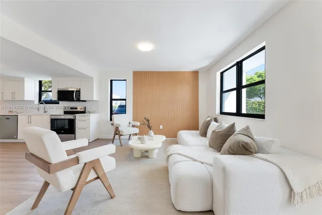 a bedroom with furniture a bed and a flat screen tv