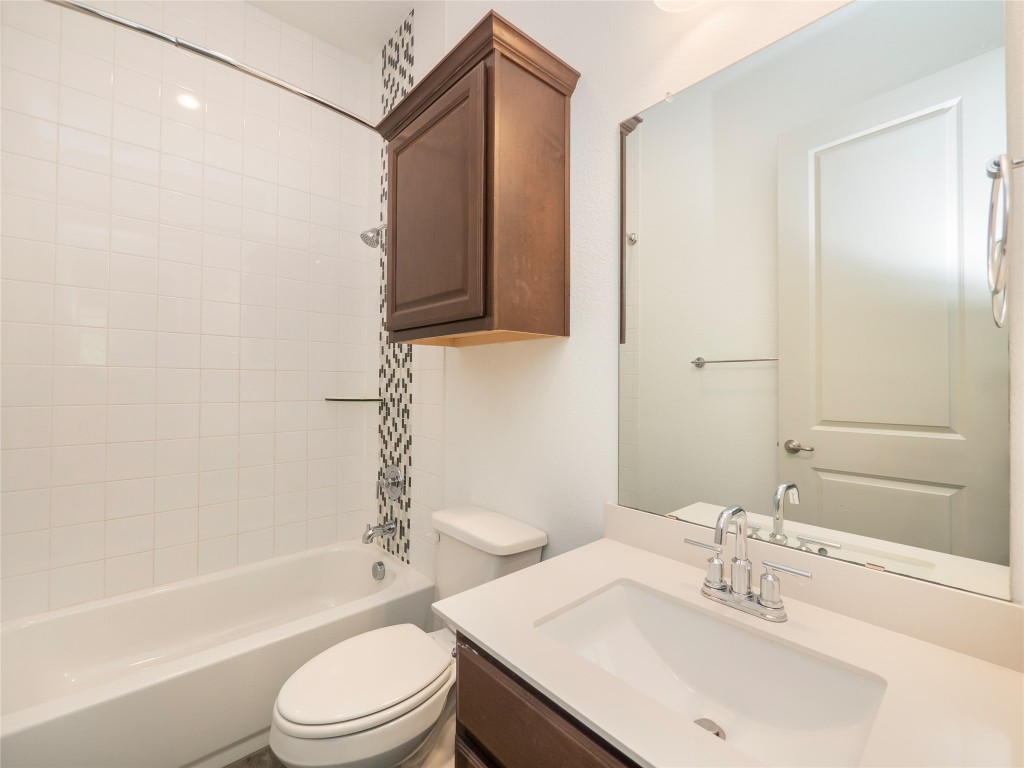 13503-13511 Carpenter Lane Manchaca, TX 78652 - Photo 11 of 40 a bathroom with a sink toilet and shower