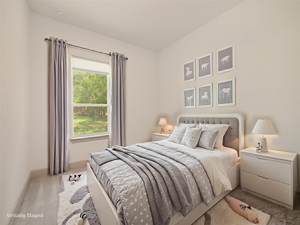 13503-13511 Carpenter Lane Manchaca, TX 78652 - Photo 12 of 40 a bedroom with a bed and a window