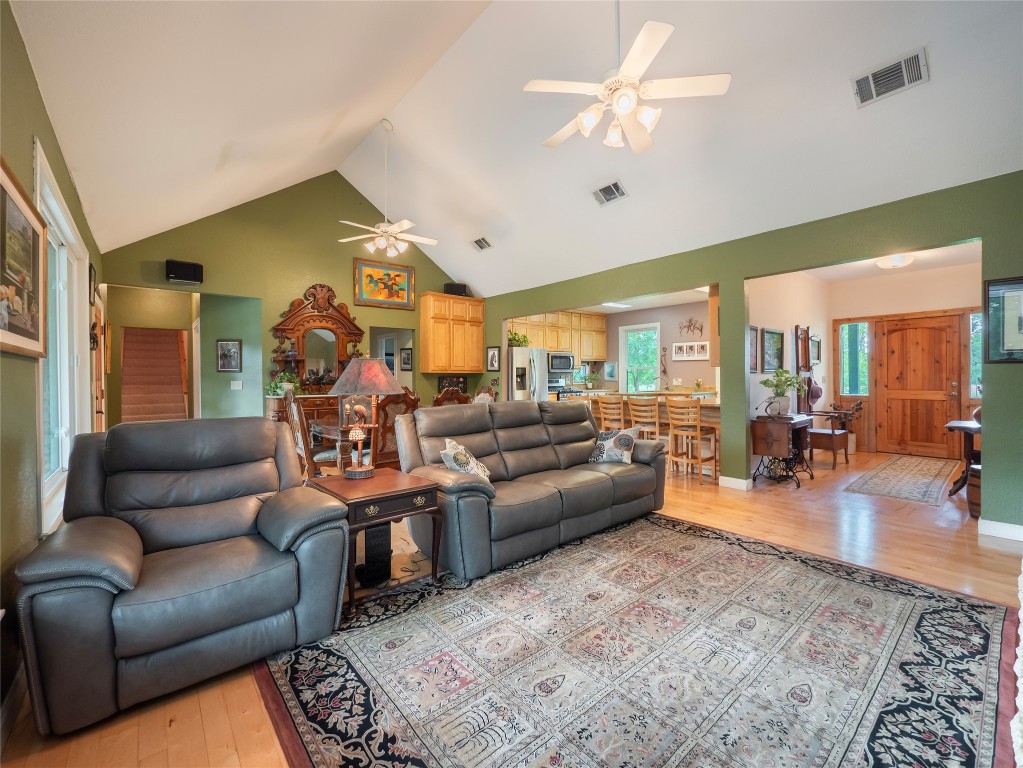 13503-13511 Carpenter Lane Manchaca, TX 78652 - Photo 22 of 40 a living room with furniture ceiling fan and a rug