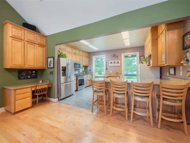 a living room with furniture ceiling fan and a rug