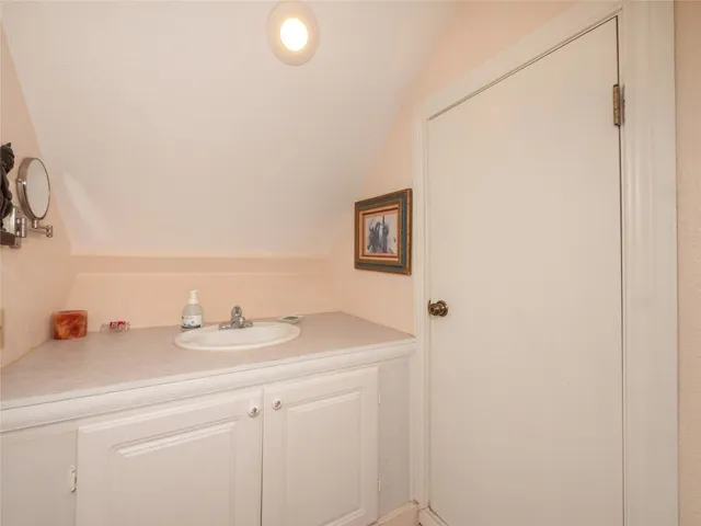 a bedroom with a bed furniture and a chandelier