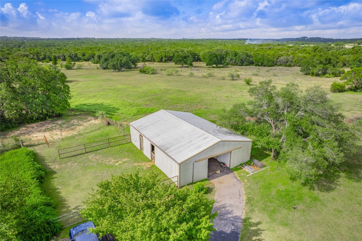 13503-13511 Carpenter Lane Manchaca, TX 78652 - Photo 35 of 40 an aerial view of a house with a yard and lake view