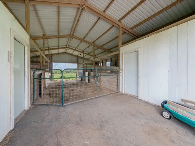 an aerial view of a house with a yard and lake view