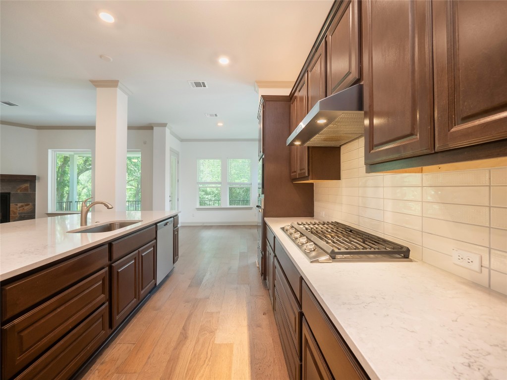 13503-13511 Carpenter Lane Manchaca, TX 78652 - Photo 5 of 40 a kitchen with granite countertop a stove and a sink