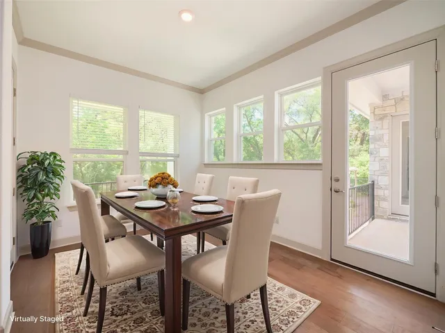 a view of a dining room with furniture window and outside view