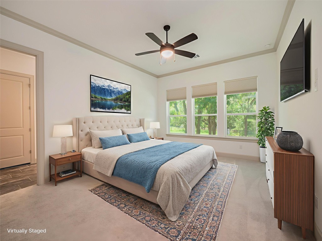 13503-13511 Carpenter Lane Manchaca, TX 78652 - Photo 7 of 40 a bedroom with a bed and a flat screen tv