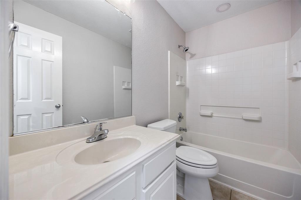 3603 Cottonwood Road Melissa, TX 75454 - Photo 16 of 22 Bathroom with tub / shower combination, vanity, and light tile patterned floors