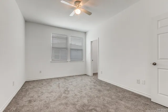 an empty room with a empty space and a window