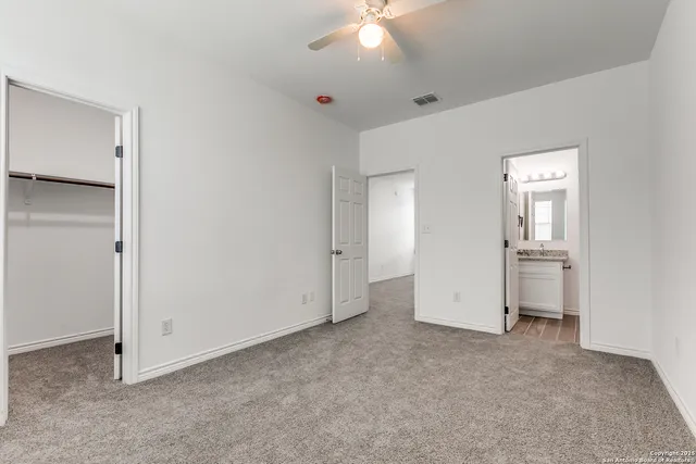 a bathroom with a sink toilet vanity and bathtub