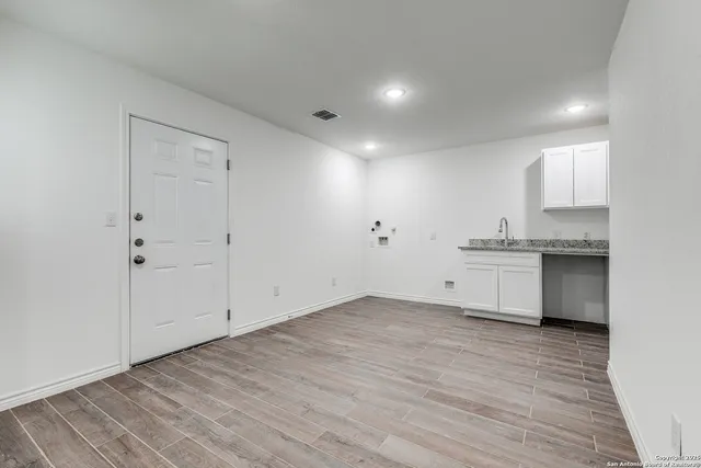a view of kitchen with wooden floor