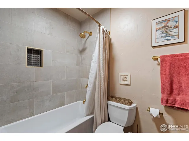 a bed room with a bed and a window