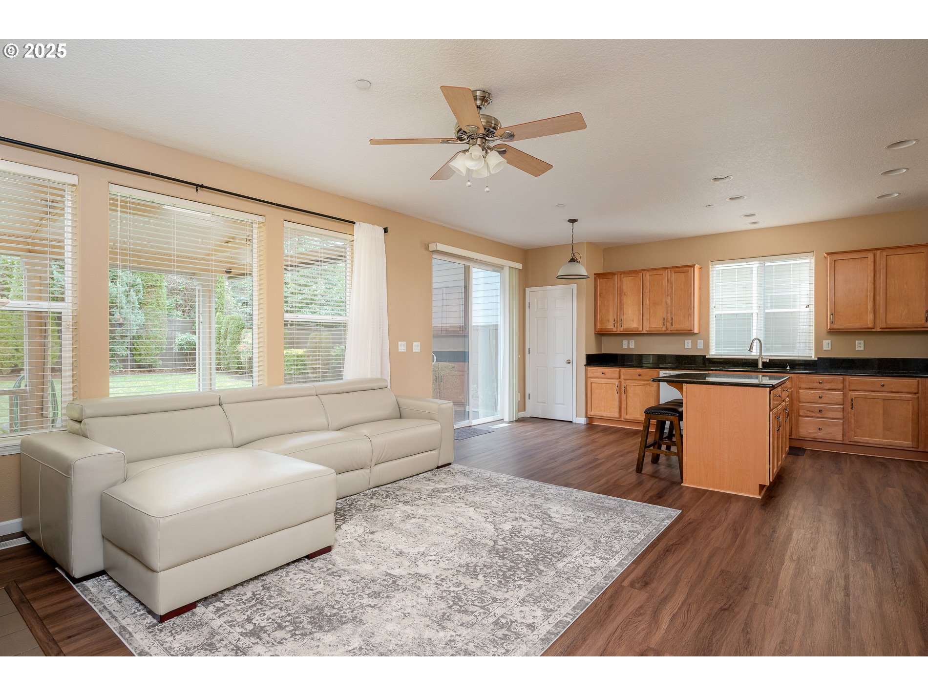 10636 Southwest 43rd Avenue Portland, OR 97219 - Photo 11 of 48 a living room with furniture and a large window