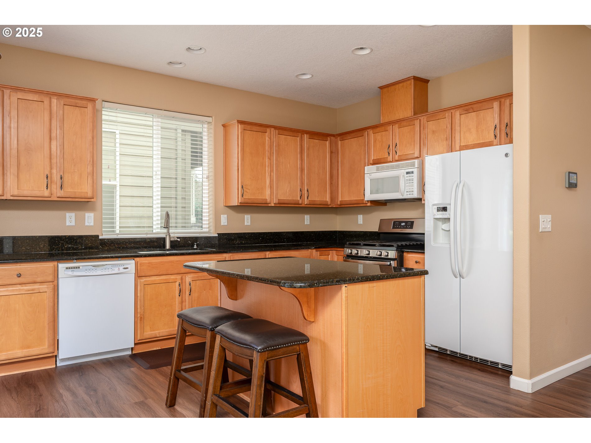 10636 Southwest 43rd Avenue Portland, OR 97219 - Photo 18 of 48 a kitchen with stainless steel appliances granite countertop a refrigerator and a stove