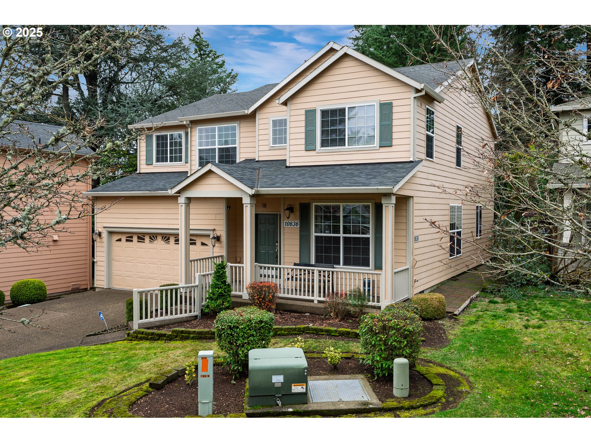 10636 Southwest 43rd Avenue Portland, OR 97219 - Photo 2 of 48 a front view of a house with a yard and potted plants
