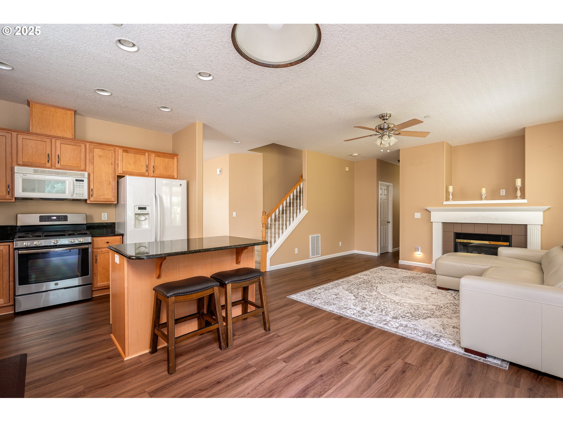 10636 Southwest 43rd Avenue Portland, OR 97219 - Photo 21 of 48 a living room with furniture and a fireplace